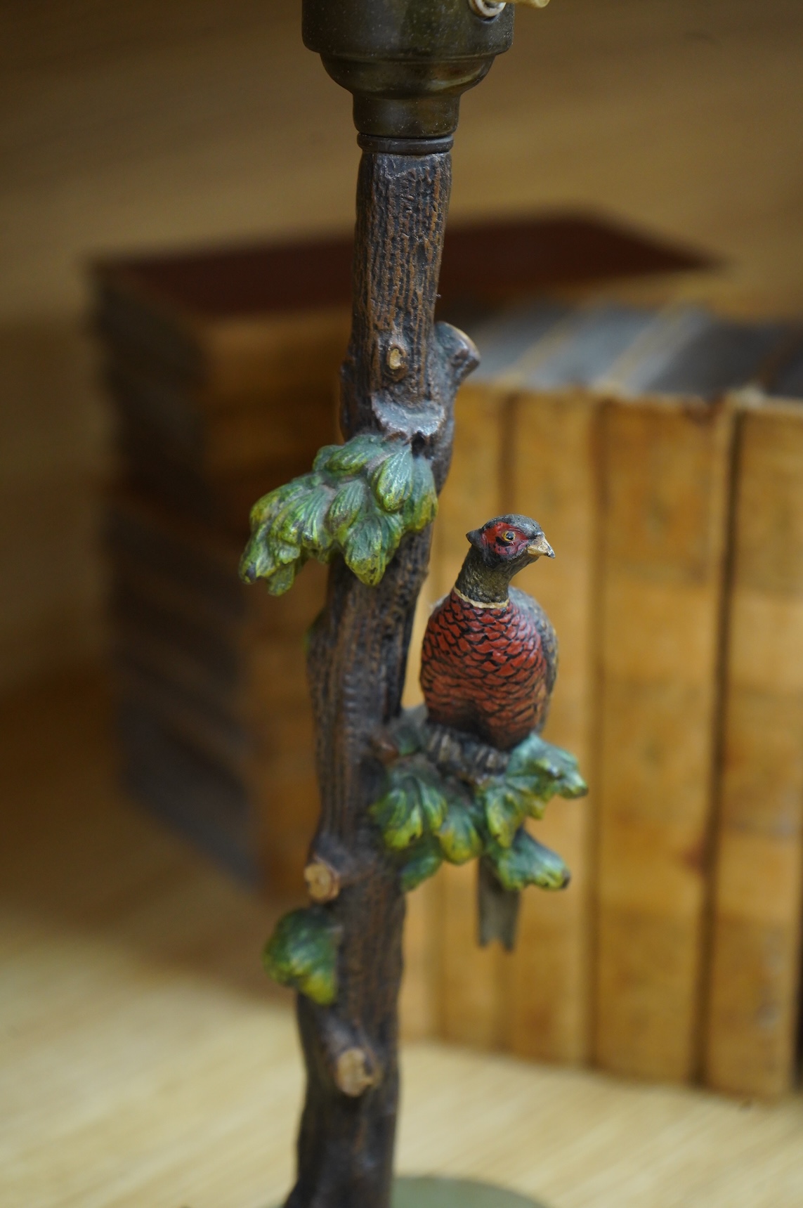 In the manner of Franz Xaver Bergmann (1861-1936), an Austrian cold painted bronze table lamp in the form a tree with pheasants, on green onyx oval base, unmarked, 34cm high including fitting